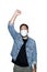 Bearded asian men worker dressed in jeans with medical mask is feeling serious raising fist up in white background.The concept of