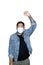 Bearded asian men worker dressed in jeans with medical mask is feeling serious raising fist up in white background.The concept of