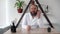 a bearded and bald Caucasian male doctor sits and works in a clinic at his workplace, close-up. call center operator is