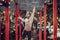 Bearded bodybuilder man exercising on monkey bars for the upper-body in a modern calisthenics park outdoors on a sunny