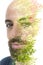 A bearded bold man and blossoming tropical tree photo double exposure portrait close up