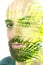 A bearded bold man and palm tree leaves photo double exposure portrait close up