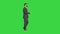 Bearded businessman walking and explaining something on a Green Screen, Chroma Key.