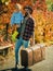 Bearded dad telling son about travelling. Traveler with lot experience. Spirit of adventurism. Father with suitcase and