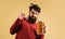 Bearded drunk man with mug of beer showing sign ok. Bad habits. Alcoholism. Stylish man drinking craft draught beer