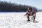 Bearded european man is boring while he fishing from ice hole