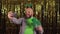 a bearded European man celebrates st patrick\'s day, shamrock horns on his head and green glasses, makes a video call.