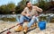 Bearded fisherman prepares fishing gear