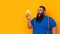 Bearded funny big man with with a surprise expression, an idea bulb and exclamation marks around