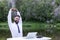 bearded guy remote manager, freelancer stretching at desk in nature