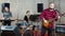 Bearded guy soloist playing guitar in studio