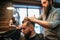 Bearded hairdresser making male hipster hairstyle