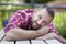 Bearded handsome man lying on a bench