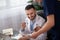 Bearded head doctor smiling while talking to his colleague