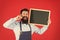 Bearded hipster cook. welcome. Restaurant or cafe advertising. great cuisine. cooking by recipe. happy man chef with