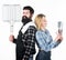 Bearded hipster and girl ready for barbecue party. Roasting and grilling food. Couple in love hold cooking utensils
