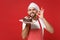 Bearded male chef cook or baker man in striped apron toque chefs hat posing isolated on red background. Cooking food
