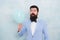 Bearded man with balloon. Stylish man in suit hold balloon. Surprise. Mature hipster with beard. what is going on