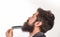 Bearded man with beard, bearded gay. Barbershop concept. Mustache men. Closeup of a young man styling his long beard