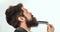 Bearded man with beard, bearded gay. Barbershop concept. Mustache men. Closeup of a young man styling his long beard