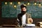 Bearded man with book and retro typewriter. Scientist make research with microscope. Man with beard and mustache in