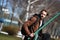 Bearded man in brown hoodie jacket with sport bag