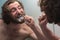 Bearded Man Brushing Teeth