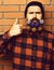Bearded man, brutal caucasian serious hipster with gift decorative stars