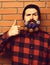 Bearded man, brutal caucasian squinting hipster with gift decorative stars