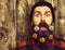 Bearded man, brutal caucasian surprised hipster with gift decoration stars