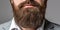 Bearded man close up. Beard is his style. Closeup of bearded mans. Male with mustache growing. Perfect beard. Close-up