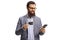 Bearded man with a credit card smiling and looking at a mobile phone