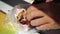 Bearded man eats lard on black bread. Pork lard closeup family having lunch