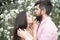 Bearded man hug sensual woman. Couple in love among blossoming trees. Skincare and freshness. Valentines day. Moments of