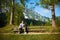 Bearded man is looking at the sky while sitting on the bench