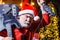 Bearded man in Santa costume with broken Electric guitar. Musical instrument. Rock guitarist. New year. Christmas time.