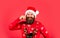 Bearded man santa hat. Emotional hipster with mustache winter sweater. Santa man. New year party. Stay warm in new home