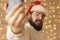 Bearded man selfie Christmas photography portrait with interior garland lamps illumination background