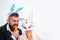 Bearded man and sexy girl. copy space. Rabbits family with bunny ears. Holiday celebration, preparation. Easter bunny
