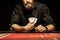 Bearded man showing poker cards