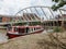 A bearded man stands on a narrowboat in Castlefield district in Machester, UK