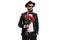 Bearded man in a suit holding a bouquet of red roses