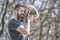 Bearded man taking photo on sunny day. Photographer concept. Man with long beard busy with shooting photos. Man with