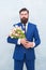 Bearded man with tulip bouquet. Love date. Womens day. March 8. Spring gift. Bearded man hipster with flowers. Celebrate