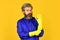 Bearded man wear rubber gloves. mature janitor in uniform yellow background. spring cleaning service. protect your hands