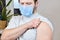 Bearded man wearing blue protective mask getting ready to be vaccinated. Covid-19 vaccination campaign