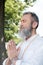bearded master guru meditating with closed