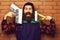 Bearded painter man holding various building tools with happy face