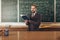 Bearded Professor in Suit and Glasses Citing a Manual