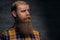 Bearded redhead male in a yellow shirt.